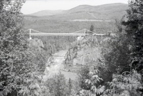 Hagwilget Bridge over the river.. (Images are provided for educational and research purposes only. Other use requires permission, please contact the Museum.) thumbnail