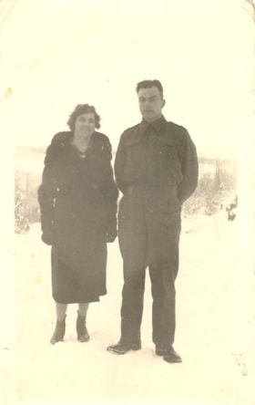 Helen Fairbairn standing with her son, John Sparkes. (Images are provided for educational and research purposes only. Other use requires permission, please contact the Museum.) thumbnail