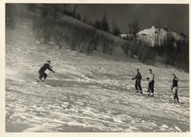 Four skiers on Malkow Hill. (Images are provided for educational and research purposes only. Other use requires permission, please contact the Museum.) thumbnail