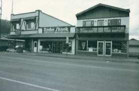 Central Clothing, Radio Shack, and The Juniper Berry storefronts on Main Street. (Images are provided for educational and research purposes only. Other use requires permission, please contact the Museum.) thumbnail