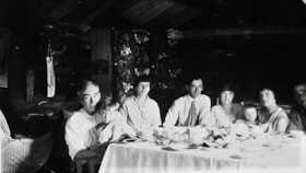 Family at a dinner table. (Images are provided for educational and research purposes only. Other use requires permission, please contact the Museum.) thumbnail