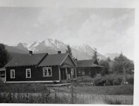 Houses in front of Hudson Bay Mountain. (Images are provided for educational and research purposes only. Other use requires permission, please contact the Museum.) thumbnail