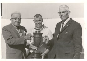 Ernest Hann, Gurth Rands, and Fred Fowler with the Seeley and Doodson Challenge Cup. (Images are provided for educational and research purposes only. Other use requires permission, please contact the Museum.) thumbnail