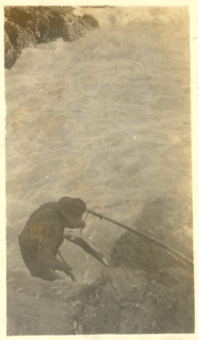 Indigenous man clubbing a harpooned salmon. (Images are provided for educational and research purposes only. Other use requires permission, please contact the Museum.) thumbnail