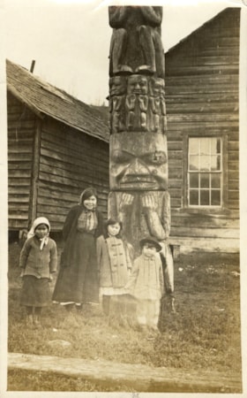 Indigenous children with Gitxsan totem pole. (Images are provided for educational and research purposes only. Other use requires permission, please contact the Museum.) thumbnail