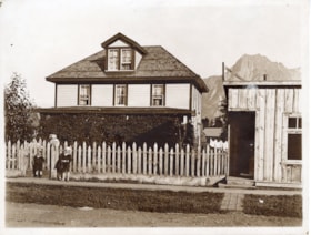 House and unidentified family in Hazelton, B.C.. (Images are provided for educational and research purposes only. Other use requires permission, please contact the Museum.) thumbnail