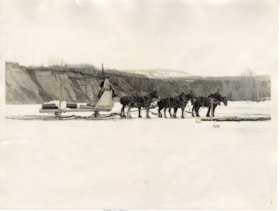 Six draft horses pulling a big sled holding two men. (Images are provided for educational and research purposes only. Other use requires permission, please contact the Museum.) thumbnail