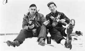 Louis Schibli and Tatsuo Aida taking a break while skiing. (Images are provided for educational and research purposes only. Other use requires permission, please contact the Museum.) thumbnail