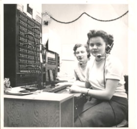 Josephine Anderson and Mary Mackney at a telephone service. (Images are provided for educational and research purposes only. Other use requires permission, please contact the Museum.) thumbnail