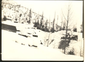 Cabins covered in snow in mountain range. (Images are provided for educational and research purposes only. Other use requires permission, please contact the Museum.) thumbnail