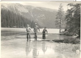 3 men at the side of a river with long poles.. (Images are provided for educational and research purposes only. Other use requires permission, please contact the Museum.) thumbnail