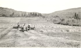 3 men on tractor and rake, raking hay in a field  thumbnail