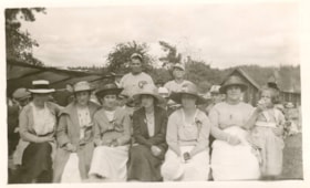 Group of ladies with 3 baseball players. (Images are provided for educational and research purposes only. Other use requires permission, please contact the Museum.) thumbnail