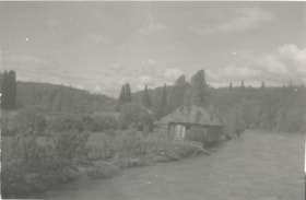 Dilapidated cabin falling into river. (Images are provided for educational and research purposes only. Other use requires permission, please contact the Museum.) thumbnail
