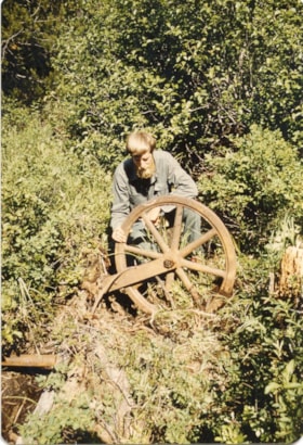 Dirk Septer with cable wheel at Coal Creek. (Images are provided for educational and research purposes only. Other use requires permission, please contact the Museum.) thumbnail