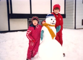 Juanita Kruisselbrink and Ann Plasway with snowman they made. (Images are provided for educational and research purposes only. Other use requires permission, please contact the Museum.) thumbnail