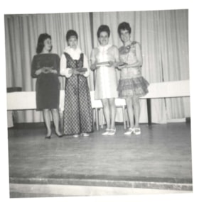 Four women at bowling awards ceremony. (Images are provided for educational and research purposes only. Other use requires permission, please contact the Museum.) thumbnail