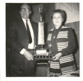 Len and Olga Evans with Men's Marathon bowling trophy. (Images are provided for educational and research purposes only. Other use requires permission, please contact the Museum.) thumbnail