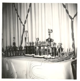 Bowling trophies laid out on table. (Images are provided for educational and research purposes only. Other use requires permission, please contact the Museum.) thumbnail
