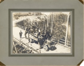 Group photo in a truck on an unidentified bridge. (Images are provided for educational and research purposes only. Other use requires permission, please contact the Museum.) thumbnail