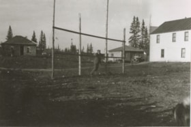 Man resting on a tall fence.. (Images are provided for educational and research purposes only. Other use requires permission, please contact the Museum.) thumbnail