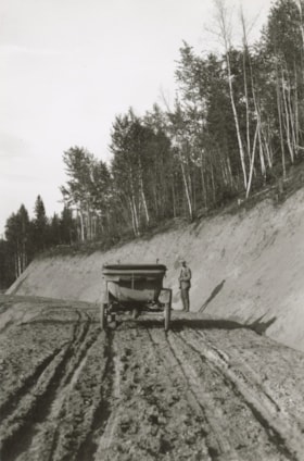 Automobile stopped on a dirt road.. (Images are provided for educational and research purposes only. Other use requires permission, please contact the Museum.) thumbnail