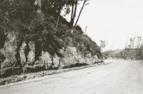 Dirt road cut out from the side of a cliff. (Images are provided for educational and research purposes only. Other use requires permission, please contact the Museum.) thumbnail