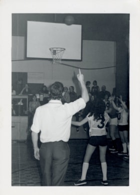 Bill Arkinstall at girls' basketball game. (Images are provided for educational and research purposes only. Other use requires permission, please contact the Museum.) thumbnail