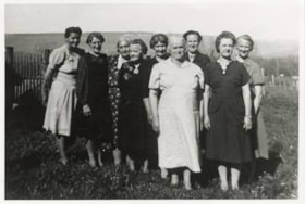 Group of women standing in field. (Images are provided for educational and research purposes only. Other use requires permission, please contact the Museum.) thumbnail
