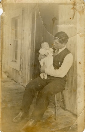 Jack Joseph holding his son, Frank Joseph. (Images are provided for educational and research purposes only. Other use requires permission, please contact the Museum.) thumbnail