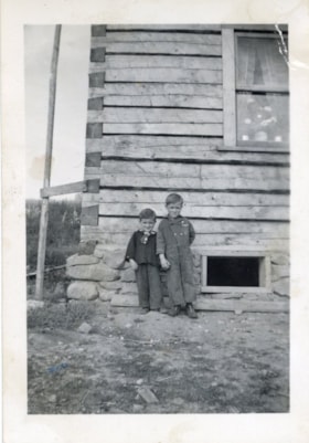 Tom Mesich and Tony Mesich in front of home on Adams Road, Smithers, B.C.. (Images are provided for educational and research purposes only. Other use requires permission, please contact the Museum.) thumbnail