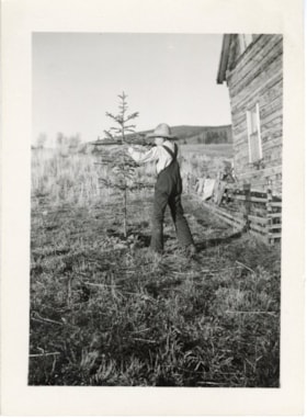 Emil Mesich practicing shooting at home on Adams Road, Smithers, B.C.. (Images are provided for educational and research purposes only. Other use requires permission, please contact the Museum.) thumbnail