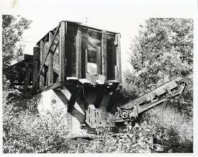 Box car loading machine. Bulkley Valley Colleries Ltd. Located C.N.R. track side, Telkwa. (Images are provided for educational and research purposes only. Other use requires permission, please contact the Museum.) thumbnail