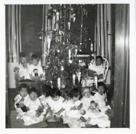 Bulkley Valley District Hospital Christmas, children in front of Christmas tree. (Images are provided for educational and research purposes only. Other use requires permission, please contact the Museum.) thumbnail