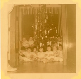 Bulkley Valley District Hospital Christmas, children in front of Christmas tree. (Images are provided for educational and research purposes only. Other use requires permission, please contact the Museum.) thumbnail