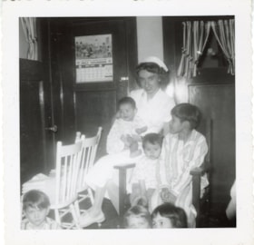 Bulkley Valley District Hospital, nurse with children. (Images are provided for educational and research purposes only. Other use requires permission, please contact the Museum.) thumbnail