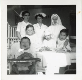 Bulkley Valley District Hospital, Rose Lörtscher (nee Adomeit), Catherine [?], and an unidentified Sister with children. (Images are provided for educational and research purposes only. Other use requires permission, please contact the Museum.) thumbnail