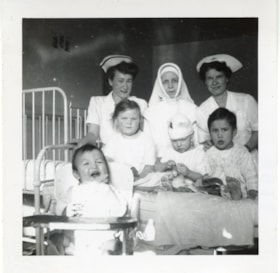 Bulkley Valley District Hospital, Mary Goodacre, an unidentified Sister, and Catherine [?] with children. (Images are provided for educational and research purposes only. Other use requires permission, please contact the Museum.) thumbnail