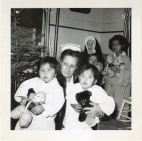 Christmas, Sister Superior and Mrs. Pierce with indigenous children. (Images are provided for educational and research purposes only. Other use requires permission, please contact the Museum.) thumbnail