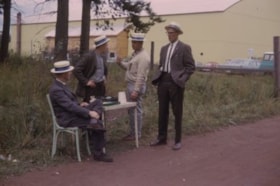 Four unidentified men at Fall Fair gate. (Images are provided for educational and research purposes only. Other use requires permission, please contact the Museum.) thumbnail