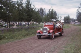 Car full of people on fairground race track. (Images are provided for educational and research purposes only. Other use requires permission, please contact the Museum.) thumbnail