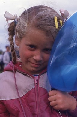 Carissa with a balloon at the Fall Fair. (Images are provided for educational and research purposes only. Other use requires permission, please contact the Museum.) thumbnail