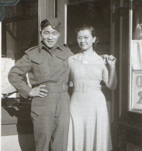 Fujio (Joe) Aida in uniform with unidentified girl. (Images are provided for educational and research purposes only. Other use requires permission, please contact the Museum.) thumbnail