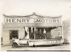 Canadian Legion float in front of Henry Motors. (Images are provided for educational and research purposes only. Other use requires permission, please contact the Museum.) thumbnail