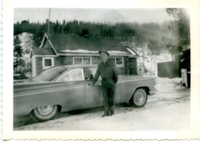 Emerson Berndt in front of his car and house. (Images are provided for educational and research purposes only. Other use requires permission, please contact the Museum.) thumbnail