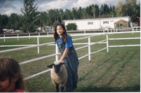 4H girl with sheep at Fall Fair. (Images are provided for educational and research purposes only. Other use requires permission, please contact the Museum.) thumbnail