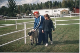 4H girl and woman with sheep at Fall Fair. (Images are provided for educational and research purposes only. Other use requires permission, please contact the Museum.) thumbnail