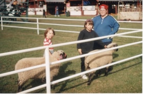 4H kids and woman with sheep at Fall Fair. (Images are provided for educational and research purposes only. Other use requires permission, please contact the Museum.) thumbnail