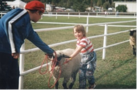 4H woman and child leading sheep at Fall Fair. (Images are provided for educational and research purposes only. Other use requires permission, please contact the Museum.) thumbnail