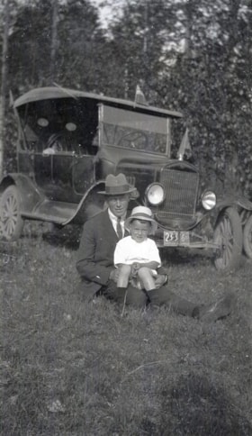 Man and child with car. (Images are provided for educational and research purposes only. Other use requires permission, please contact the Museum.) thumbnail
